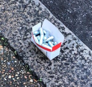 Image of nitrous oxide cartridges on the street