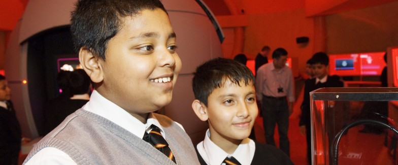 Picture of two boys looking at an exhibit