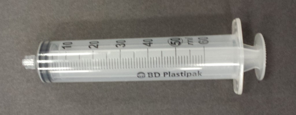 Plastic syringe